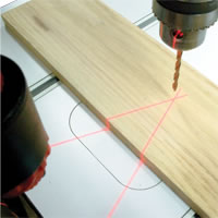 Two red laser beams cross at the exact location the drill bit is going to contact the stock